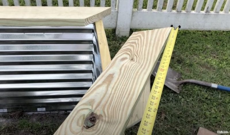 placing the top raised garden bed pieces