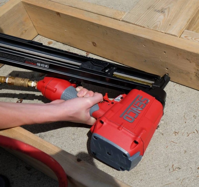 Senco FramePro 325FRHXP face nailing into a window sill plate.