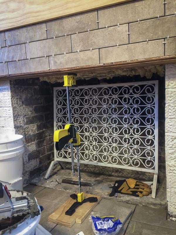 tiling over brick fireplace