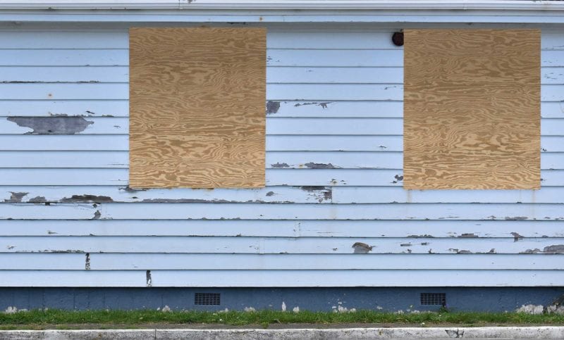 best way to board up abandoned house