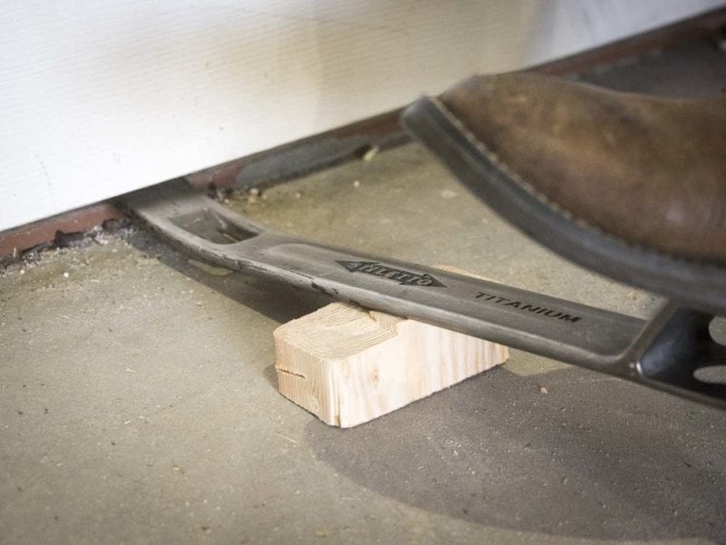 use a pry bar to lift a door and hang or install it