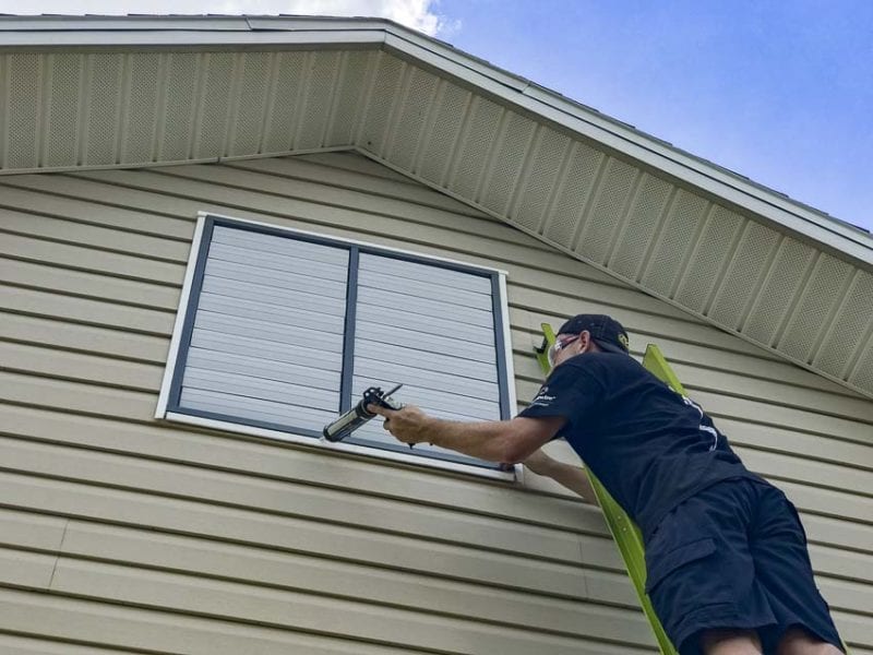 caulking the exterior exhaust fan frame