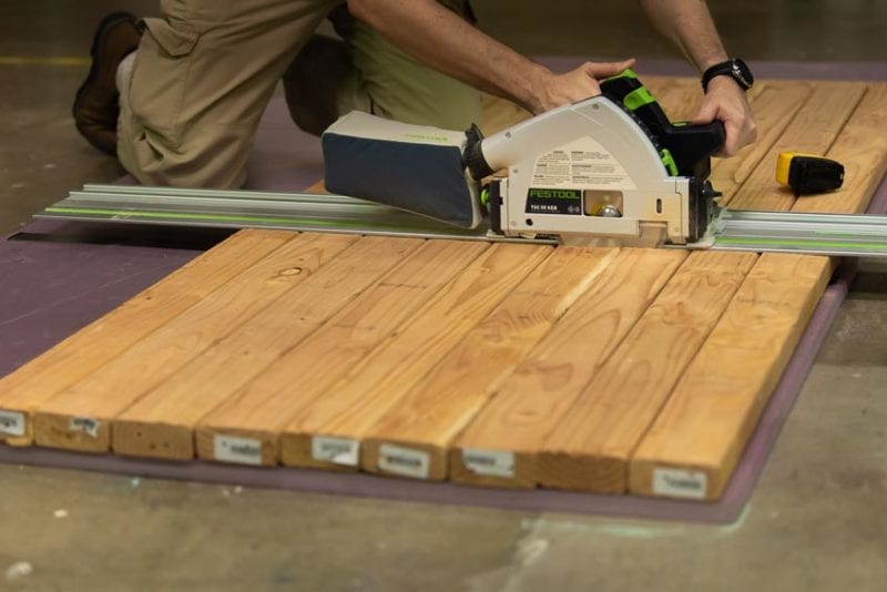 Festool cordless track saw cutting 9 2x4s