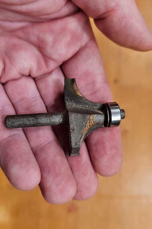 This router bit has too much resin on it and is starting to burn the wood. The solution it not to replace the bit. Instead, soak the bit with Pin Sol, then clean with a tooth brush.